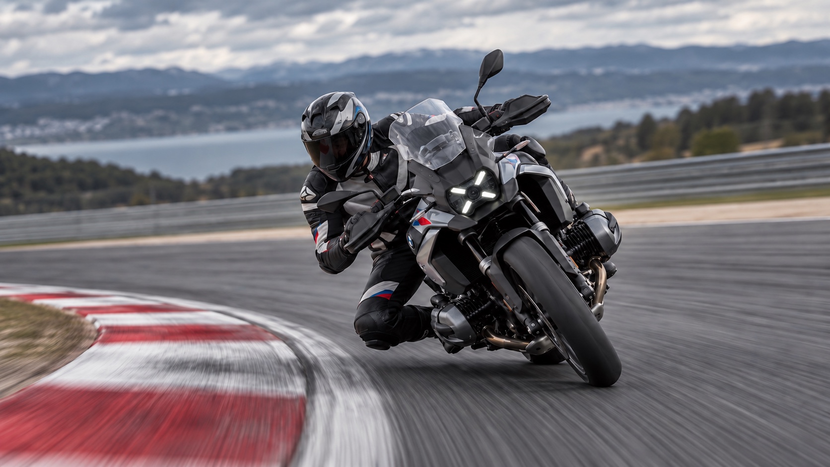 BMW R 1300 GS cornering at speed on a race circuit